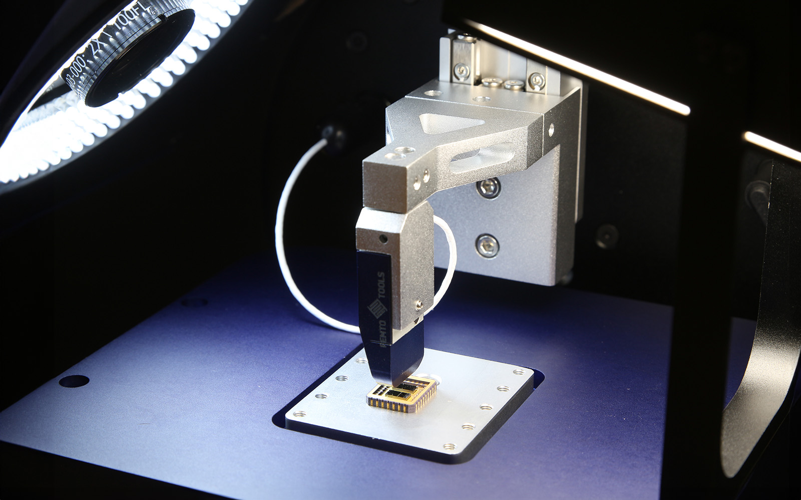<p>Close-up of Femto-Indenter tip engaged with material for nanomechanical testing.</p>
